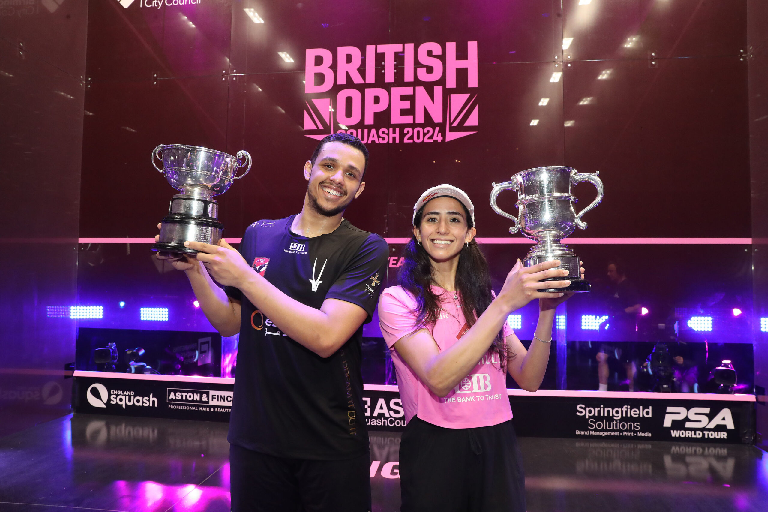 Mostafa Asal and Nouran Gohar with the 2024 British Open trophies.